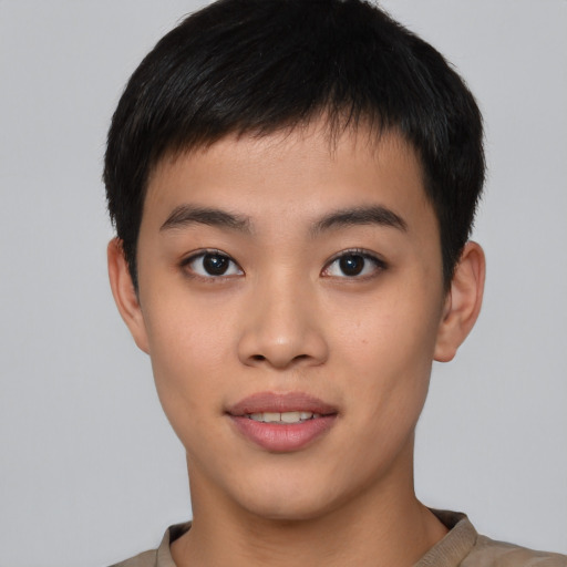 Joyful asian young-adult male with short  black hair and brown eyes