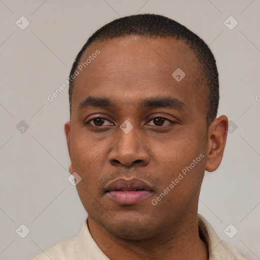 Neutral latino young-adult male with short  black hair and brown eyes