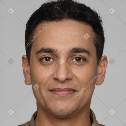 Joyful white adult male with short  black hair and brown eyes