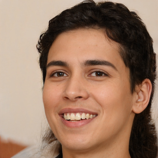 Joyful white young-adult male with medium  brown hair and brown eyes