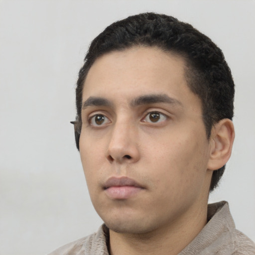 Neutral latino young-adult male with short  black hair and brown eyes