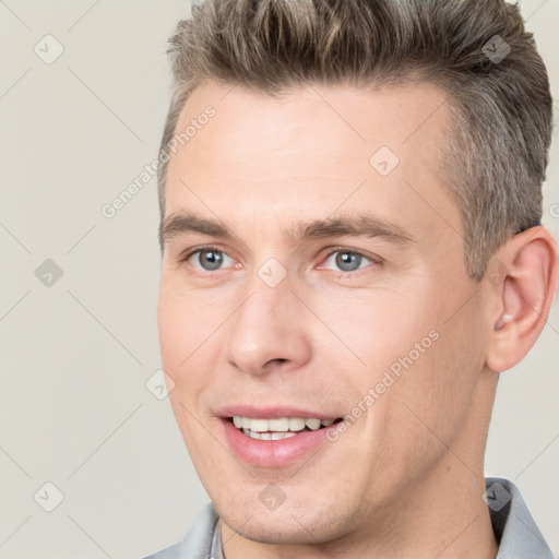 Joyful white adult male with short  brown hair and brown eyes