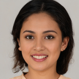 Joyful white young-adult female with medium  brown hair and brown eyes