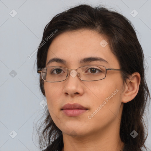 Neutral white young-adult female with long  brown hair and brown eyes