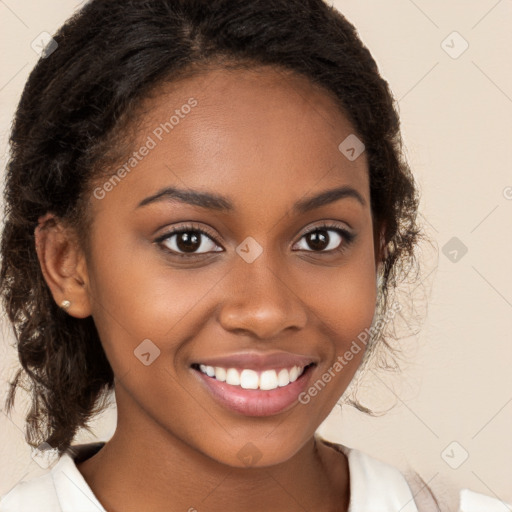 Joyful black young-adult female with long  brown hair and brown eyes