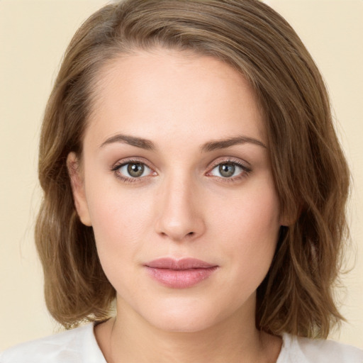 Neutral white young-adult female with medium  brown hair and green eyes