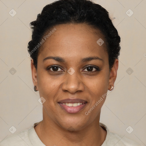 Joyful black young-adult female with short  black hair and brown eyes