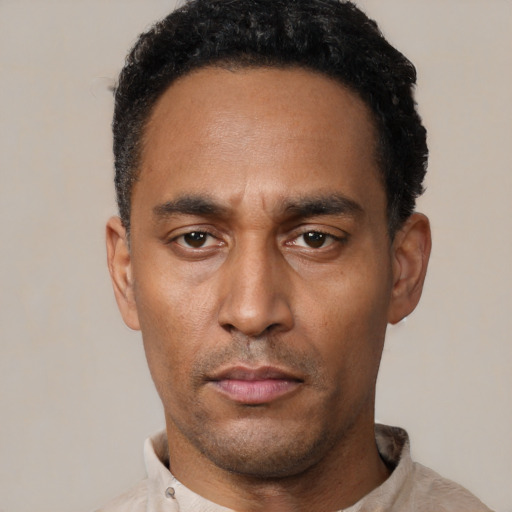 Neutral black young-adult male with short  black hair and brown eyes