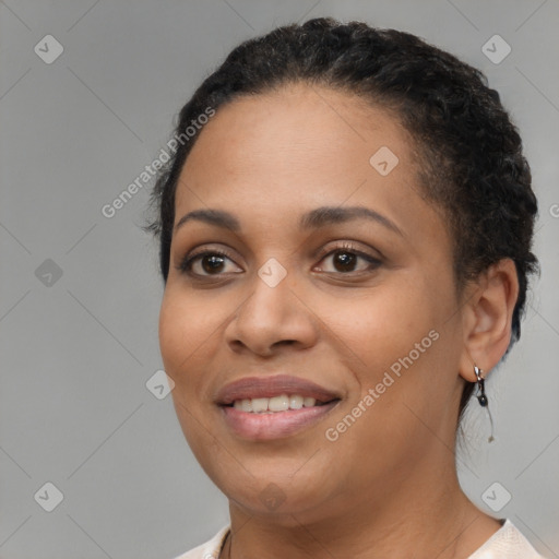 Joyful black young-adult female with short  brown hair and brown eyes