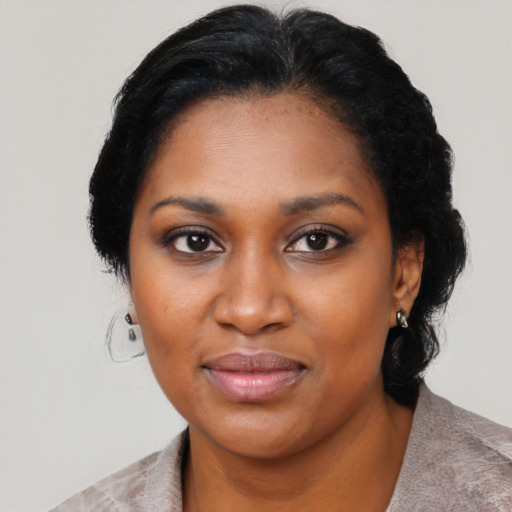 Joyful black young-adult female with medium  black hair and brown eyes