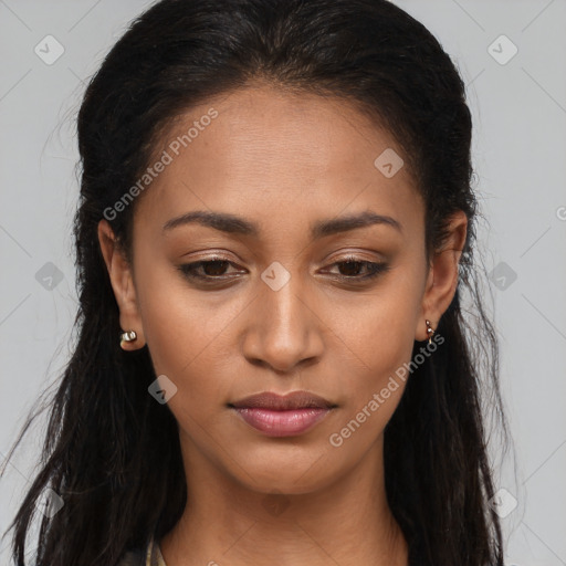 Joyful latino young-adult female with long  brown hair and brown eyes