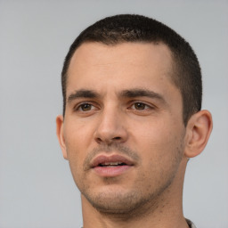 Neutral white young-adult male with short  black hair and brown eyes