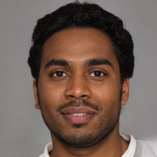 Neutral black young-adult male with short  black hair and brown eyes
