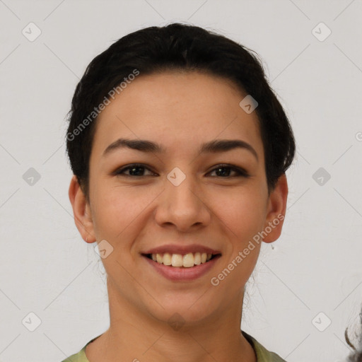 Joyful latino young-adult female with short  black hair and brown eyes