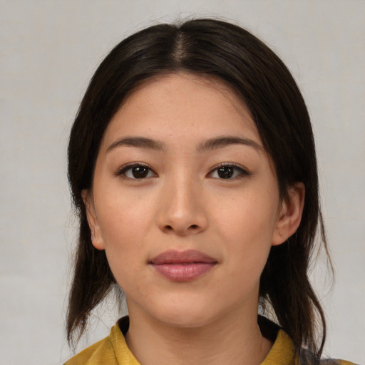 Joyful asian young-adult female with medium  brown hair and brown eyes