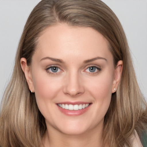 Joyful white young-adult female with long  brown hair and grey eyes