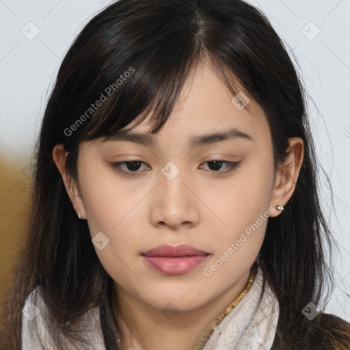 Joyful asian young-adult female with long  brown hair and brown eyes