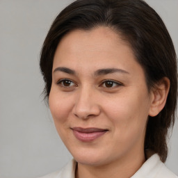 Joyful white young-adult female with medium  brown hair and brown eyes