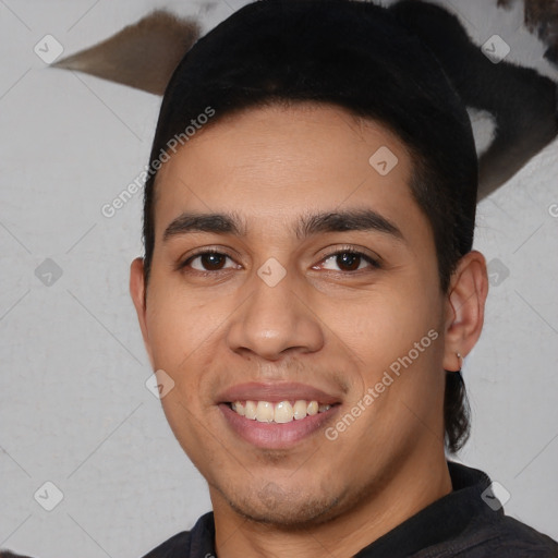 Joyful white young-adult male with short  black hair and brown eyes