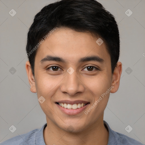 Joyful latino young-adult male with short  black hair and brown eyes