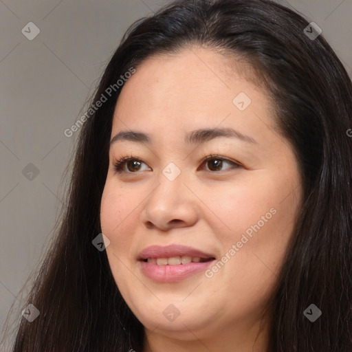 Joyful asian young-adult female with long  brown hair and brown eyes