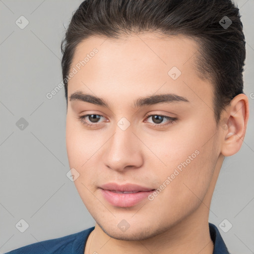 Joyful white young-adult male with short  brown hair and brown eyes