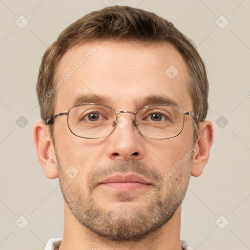 Joyful white adult male with short  brown hair and brown eyes