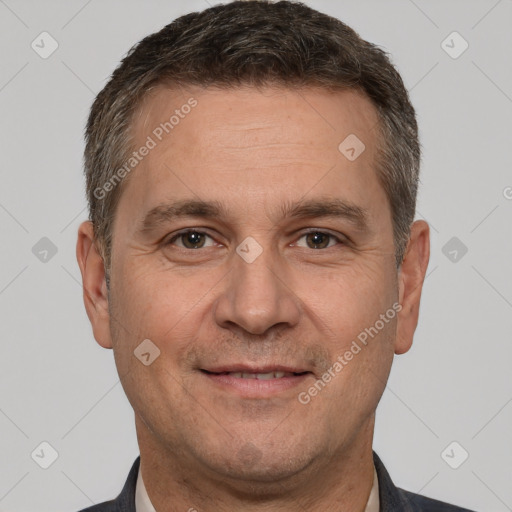 Joyful white adult male with short  brown hair and brown eyes