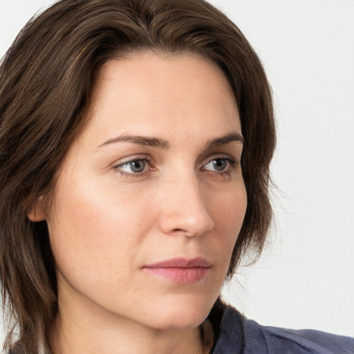 Neutral white young-adult female with medium  brown hair and grey eyes