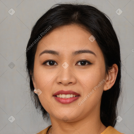 Joyful latino young-adult female with medium  black hair and brown eyes