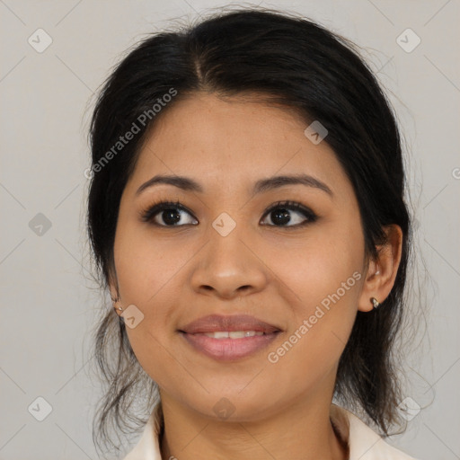 Joyful latino young-adult female with medium  brown hair and brown eyes