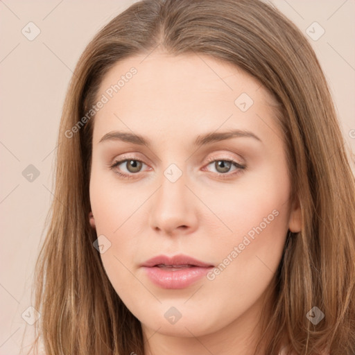 Neutral white young-adult female with long  brown hair and brown eyes