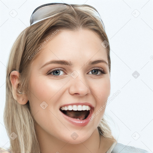 Joyful white young-adult female with long  brown hair and blue eyes