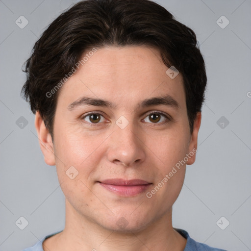 Joyful white young-adult male with short  brown hair and brown eyes