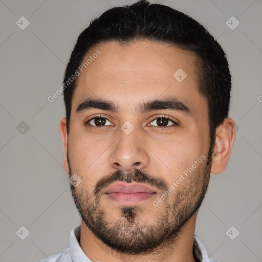 Neutral latino young-adult male with short  black hair and brown eyes