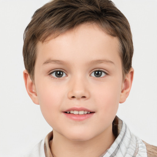 Joyful white child male with short  brown hair and brown eyes