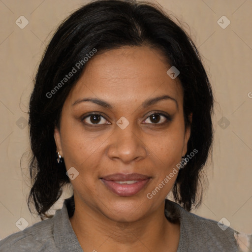 Joyful black adult female with medium  brown hair and brown eyes