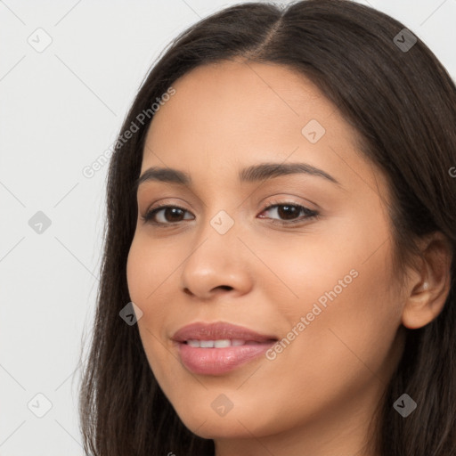 Joyful latino young-adult female with long  brown hair and brown eyes