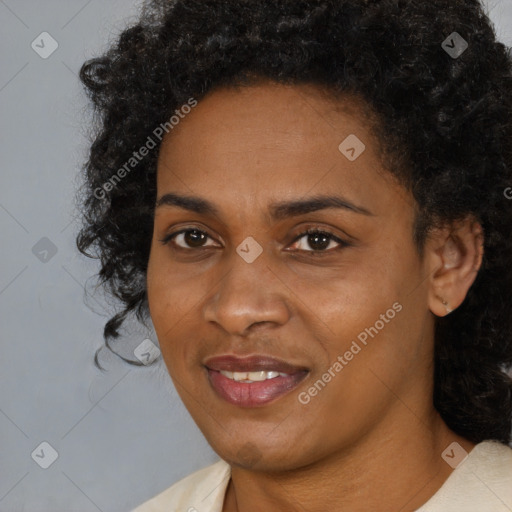 Joyful black young-adult female with medium  black hair and brown eyes