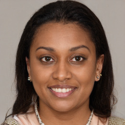 Joyful latino young-adult female with medium  brown hair and brown eyes