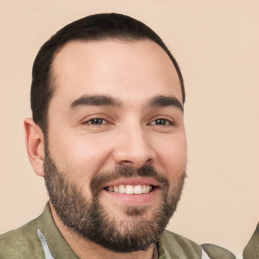 Joyful white young-adult male with short  black hair and brown eyes