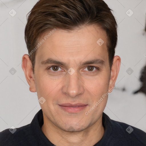 Joyful white adult male with short  brown hair and brown eyes