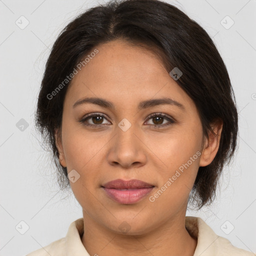 Joyful latino young-adult female with medium  brown hair and brown eyes