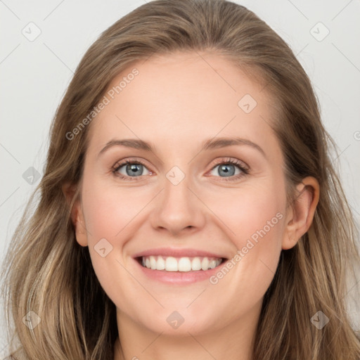 Joyful white young-adult female with long  brown hair and blue eyes