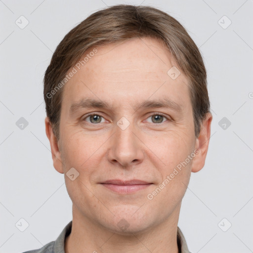 Joyful white adult male with short  brown hair and grey eyes