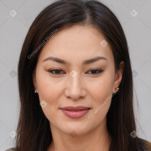 Joyful asian young-adult female with long  brown hair and brown eyes