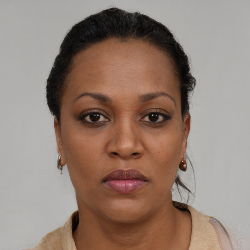 Neutral black young-adult female with short  brown hair and brown eyes