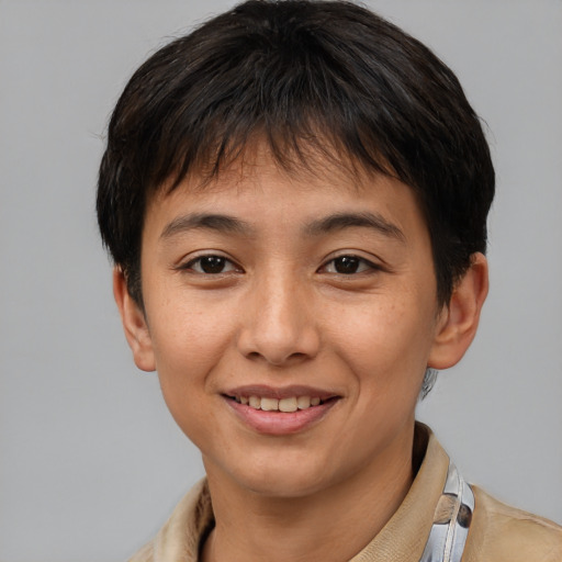 Joyful latino young-adult female with short  brown hair and brown eyes