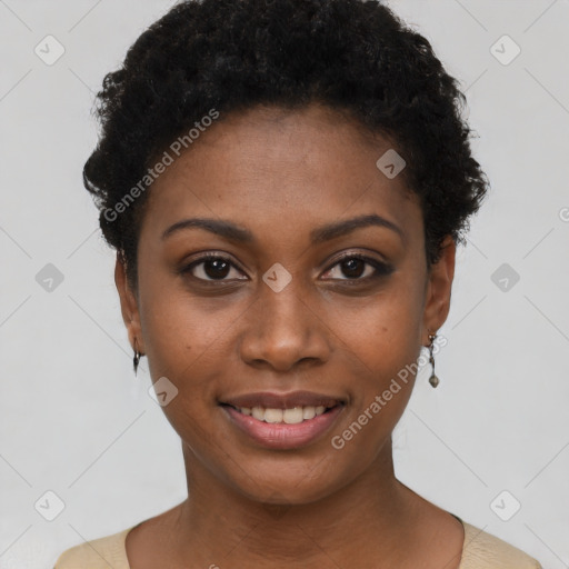 Joyful black young-adult female with short  black hair and brown eyes