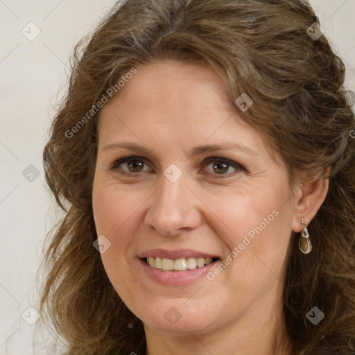 Joyful white adult female with long  brown hair and brown eyes